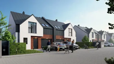 Nowoczesne szeregowce z podjazdami, samochodami, rowerami i spacerującymi mieszkańcami z psem.